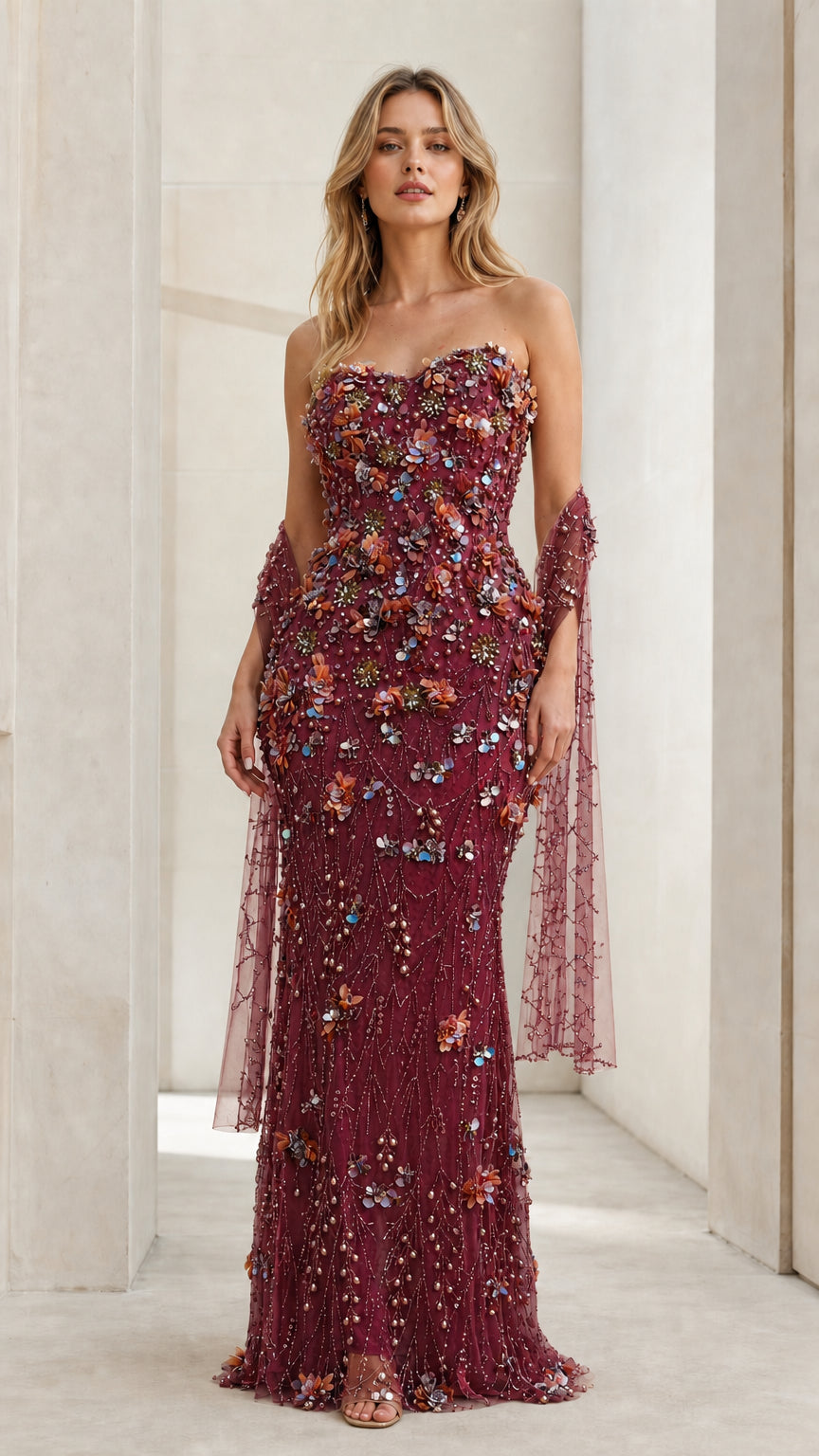 Front view of model wearing Burgundy strapless floral beaded evening gown