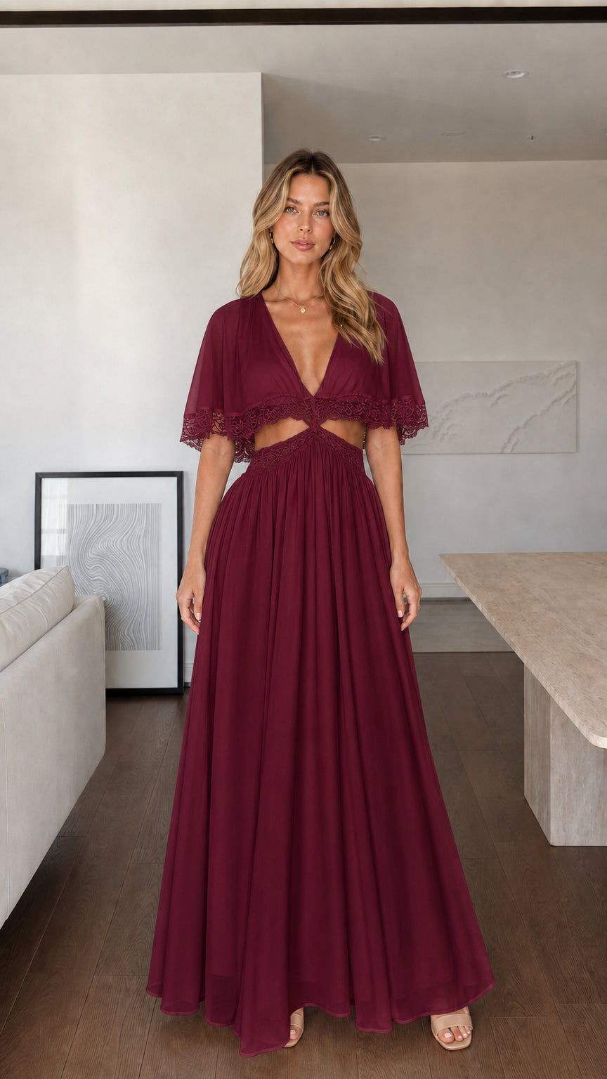 Front view of woman wearing burgundy maxi dress with lace cut-outs
