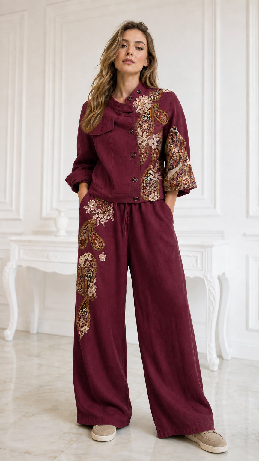 Model wearing burgundy wine embroidered beaded jacket and matching wide-leg pants set