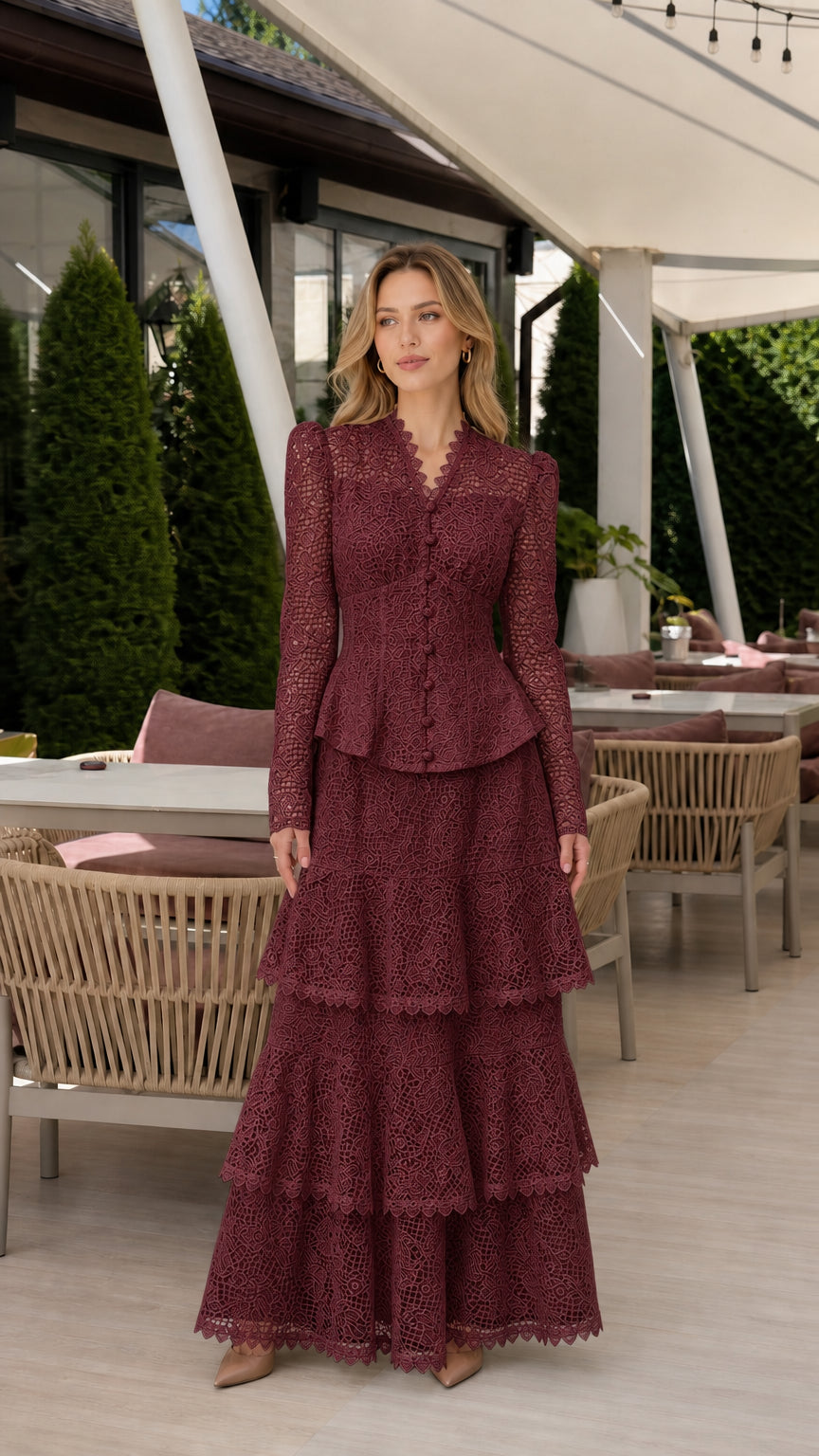 Front full view of woman wearing burgundy wine long-sleeve lace peplum tiered maxi dress