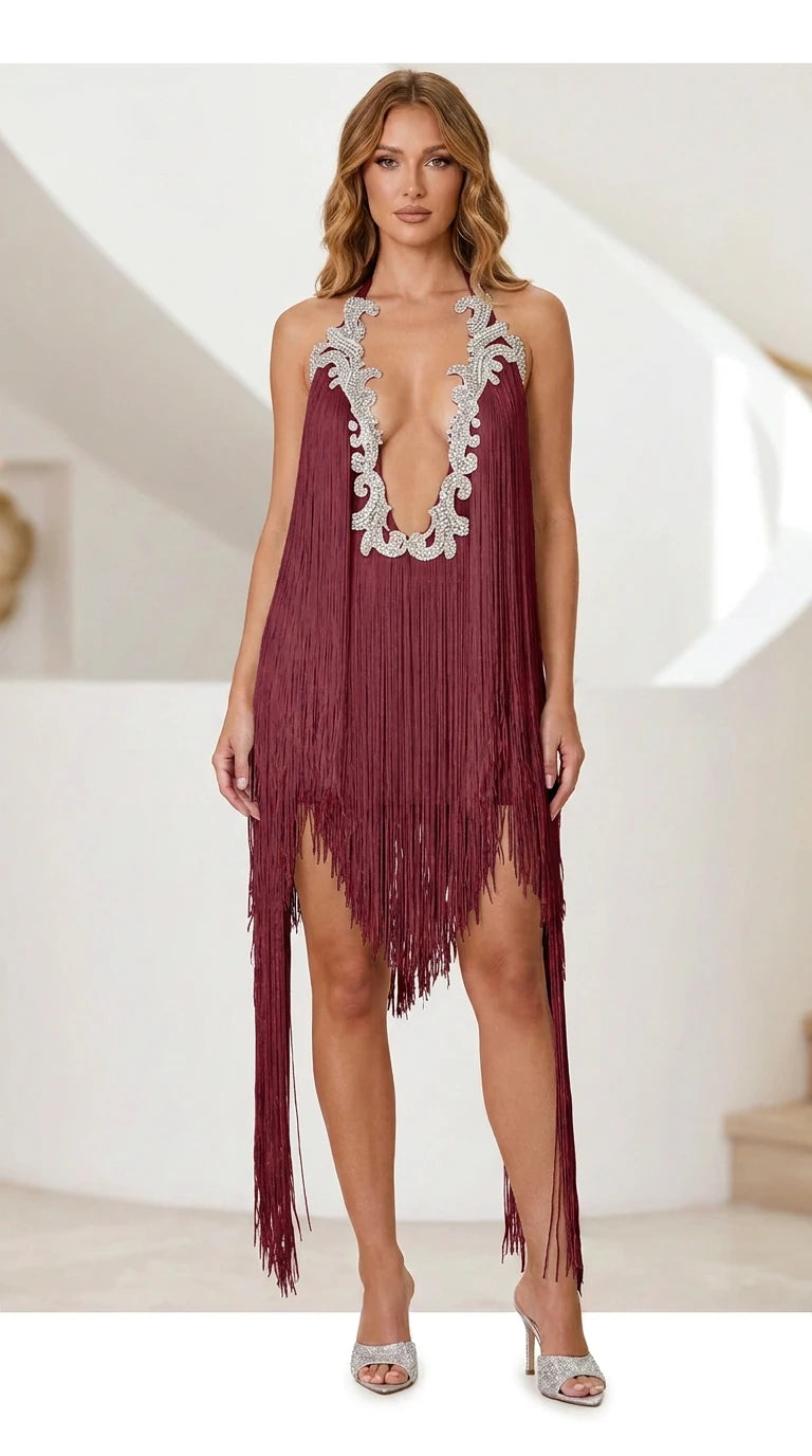 Model wearing burgundy fringe halter mini dress