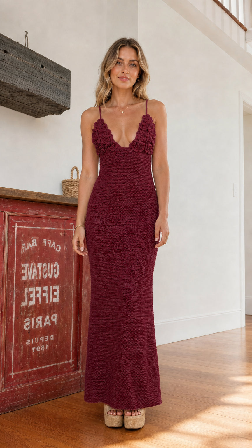 Front view of woman wearing burgundy crochet maxi dress