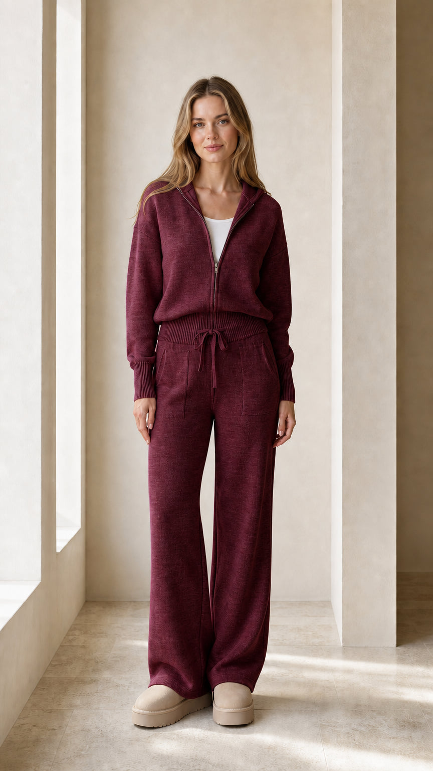Front view of the burgundy women's zip-up hoodie and pants set