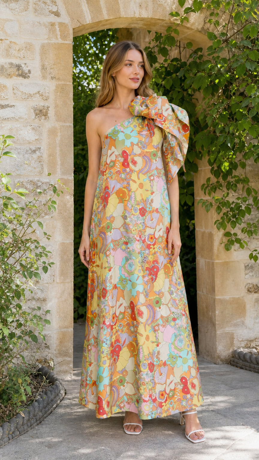 Model wearing pastel multi floral one-shoulder maxi dress
