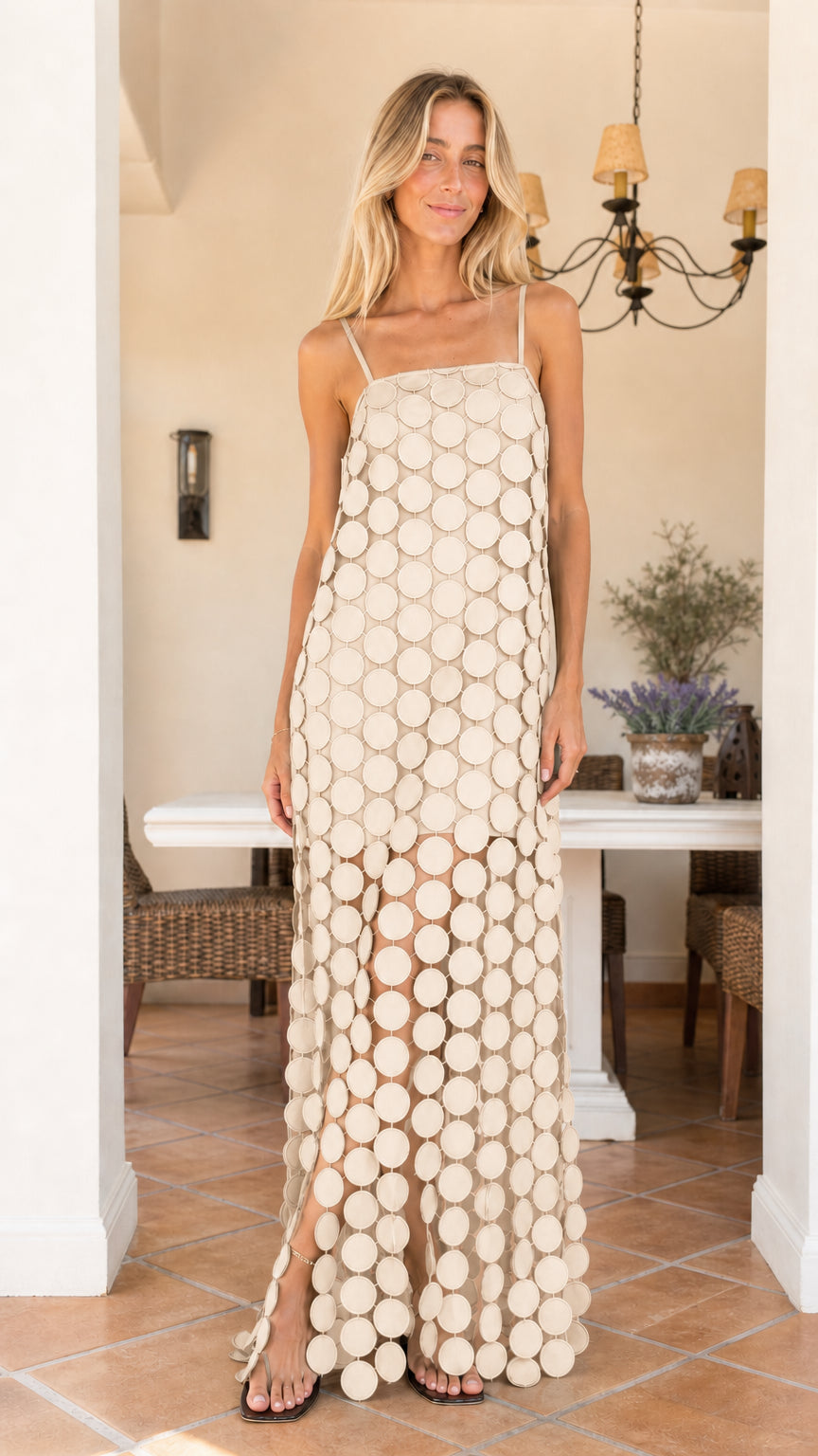 Front view of woman wearing beige cutout circle maxi dress
