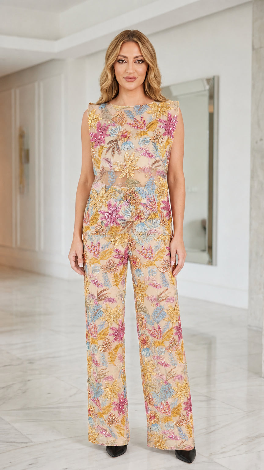 Front view of model wearing champagne sequin floral mesh two-piece set