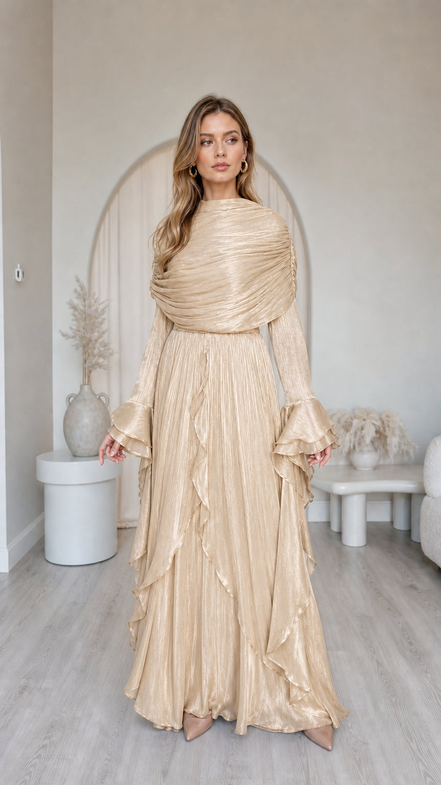 Front view of model wearing metallic champagne pleated long sleeve maxi dress