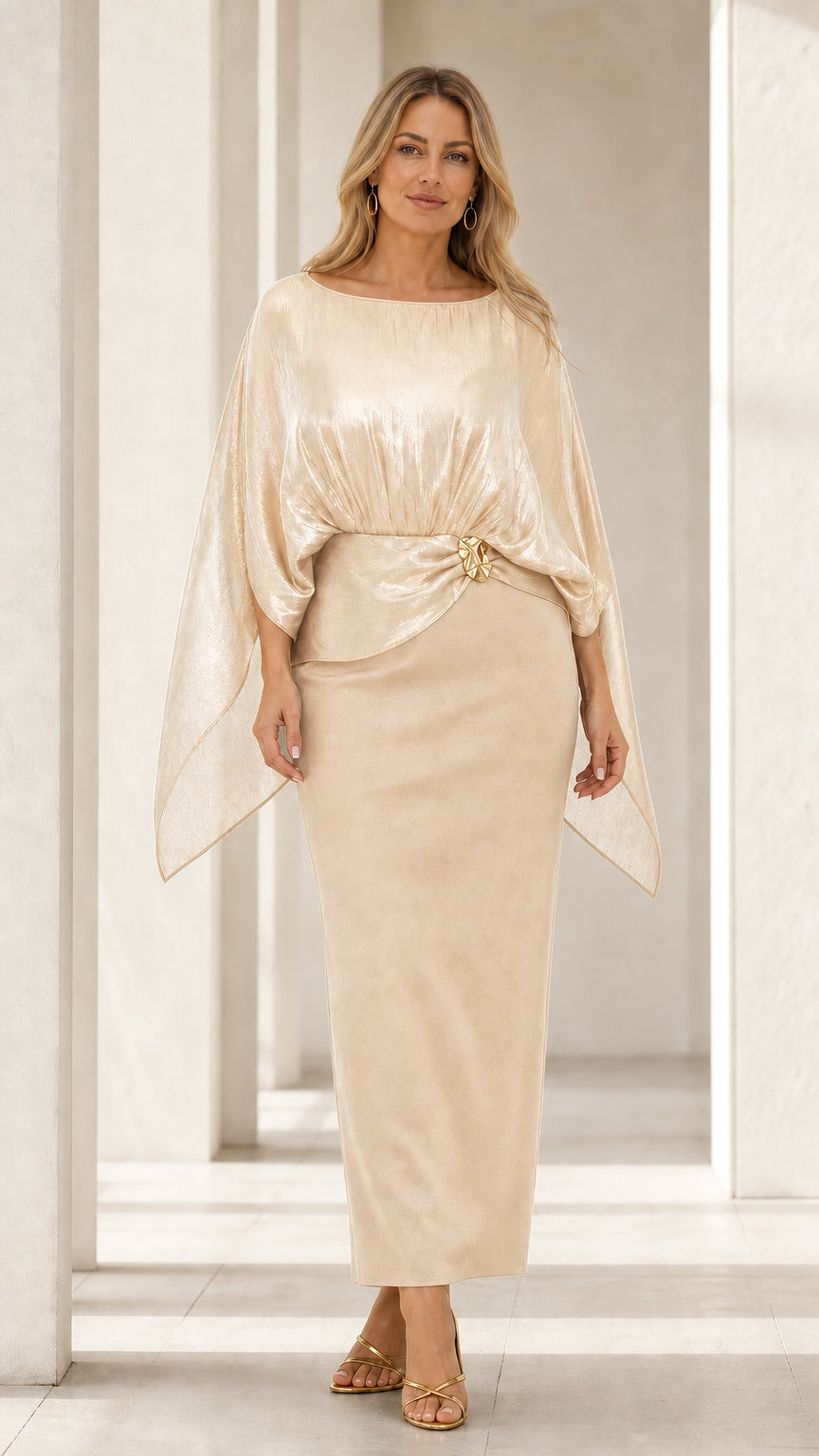 Front view of woman wearing champagne gold shimmer capelet evening column dress