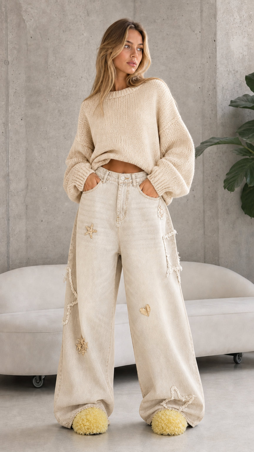Full front view of cream off-white celestial star embroidered wide leg denim trousers