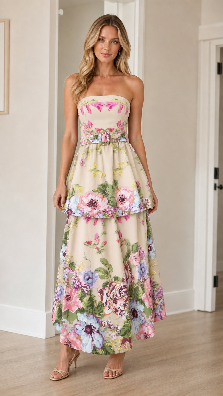 Woman wearing cream floral strapless tiered maxi dress
