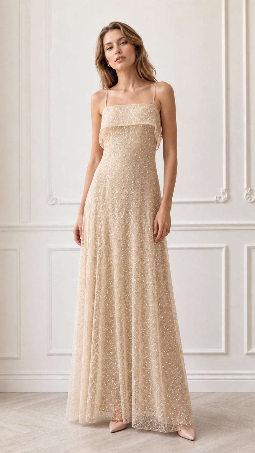 Model wearing champagne gold sequin embroidered formal maxi gown