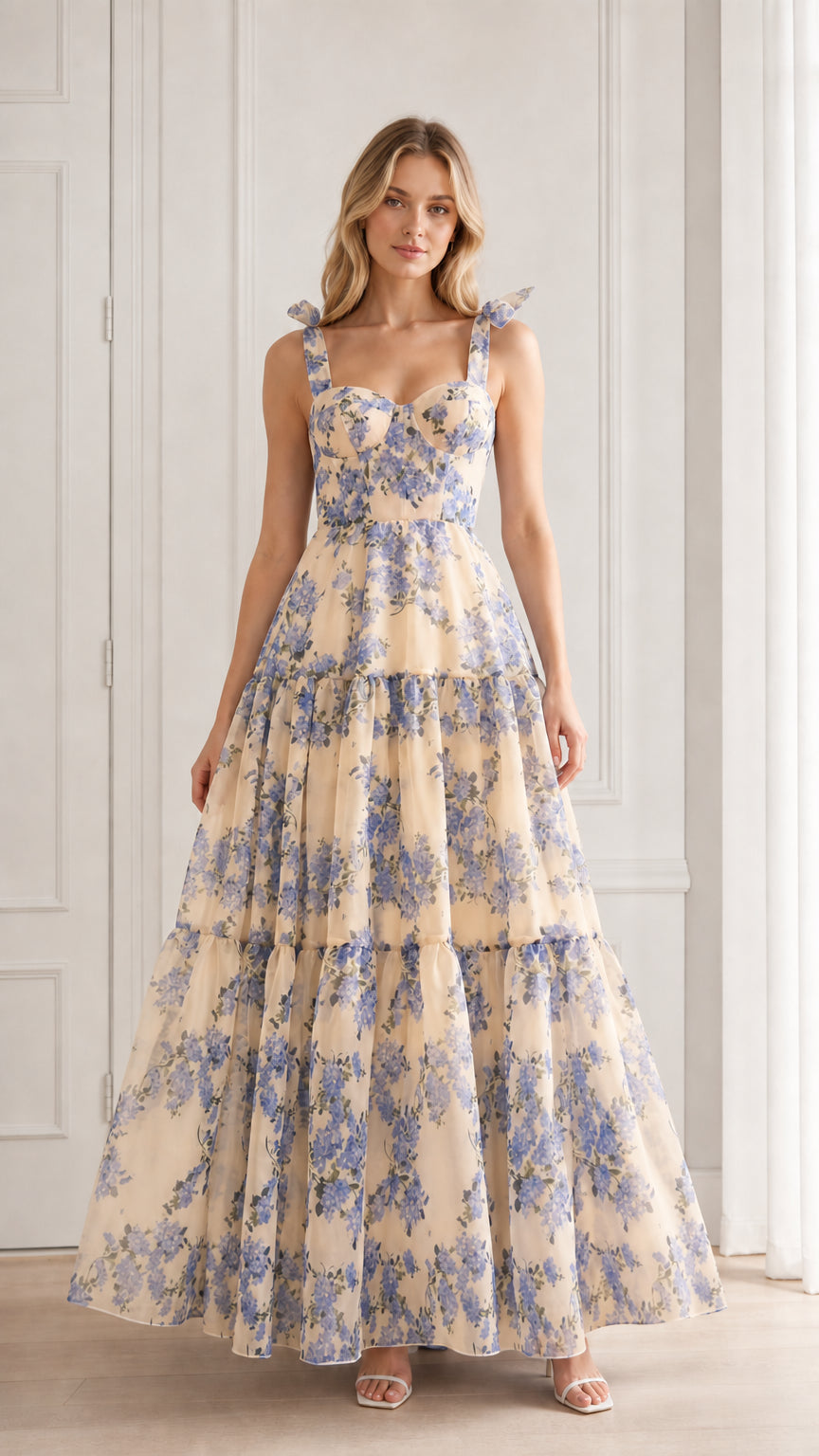 Model wearing beige floral tiered maxi dress