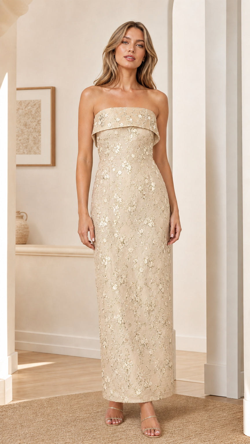 Model wearing champagne gold strapless floral embroidered maxi dress