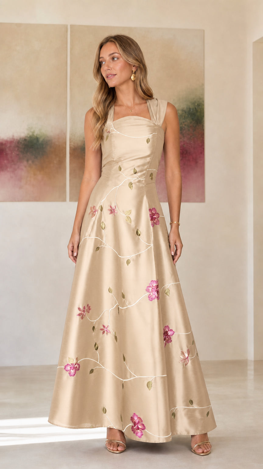 Model wearing champagne embroidered floral evening dress
