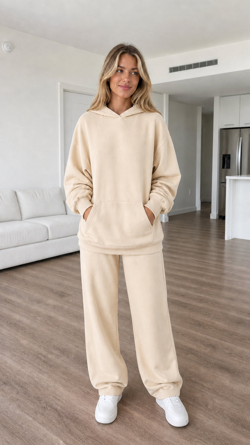 Model wearing beige oversized hoodie and sweatpants set