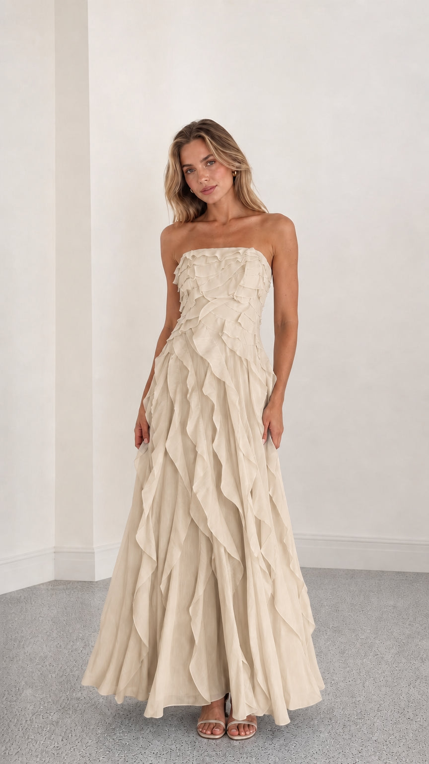 Full length view of beige strapless ruffle maxi dress