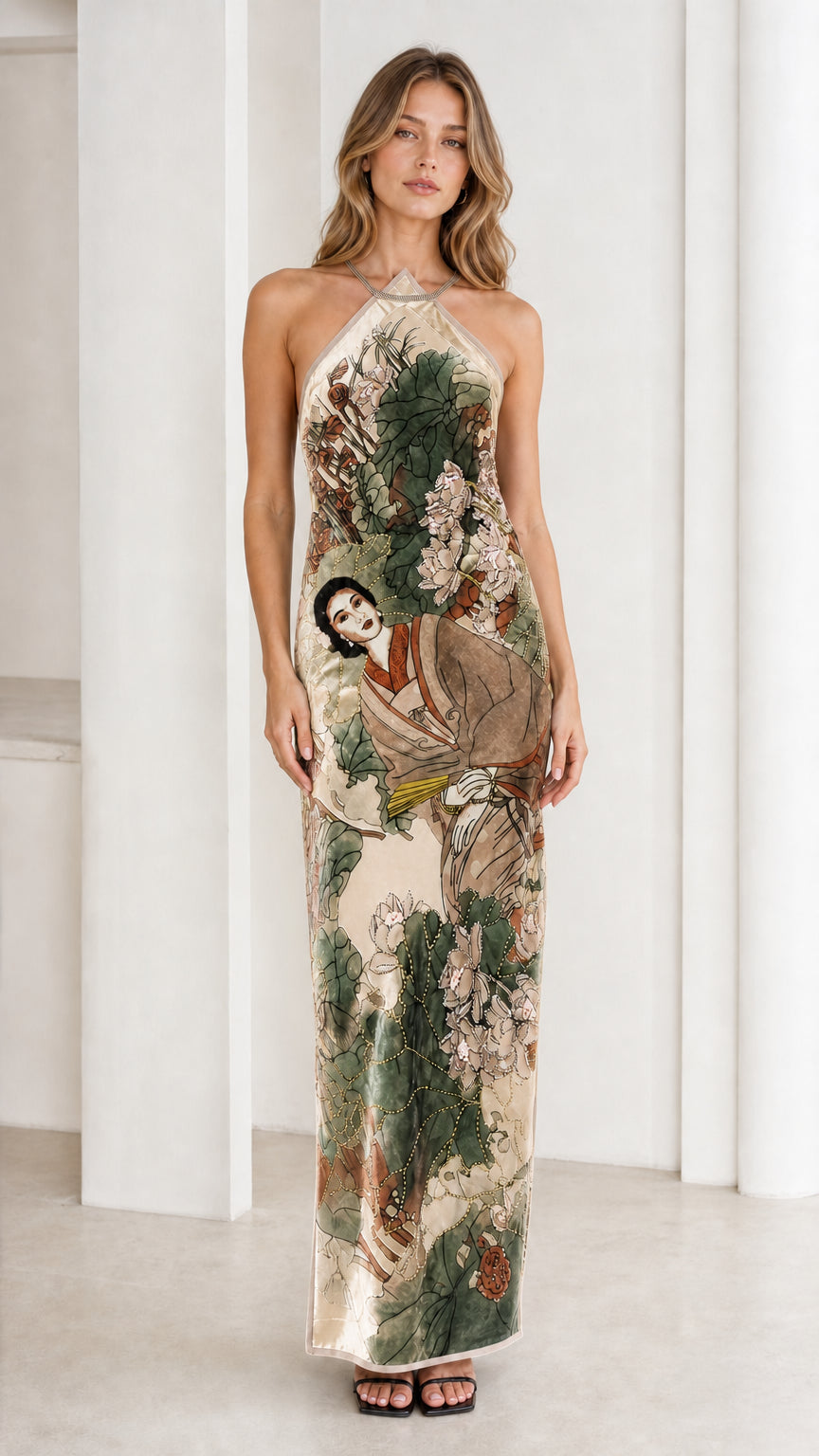 Model wearing champagne velvet halter maxi dress