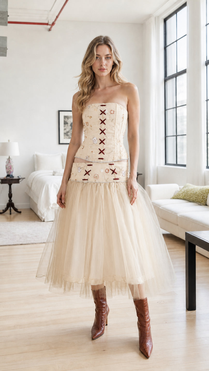 Model wearing champagne embroidered corset and tulle skirt set