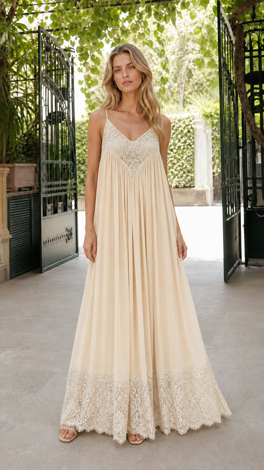 Front view of woman wearing champagne cream monochromatic lace trim pleated maxi dress
