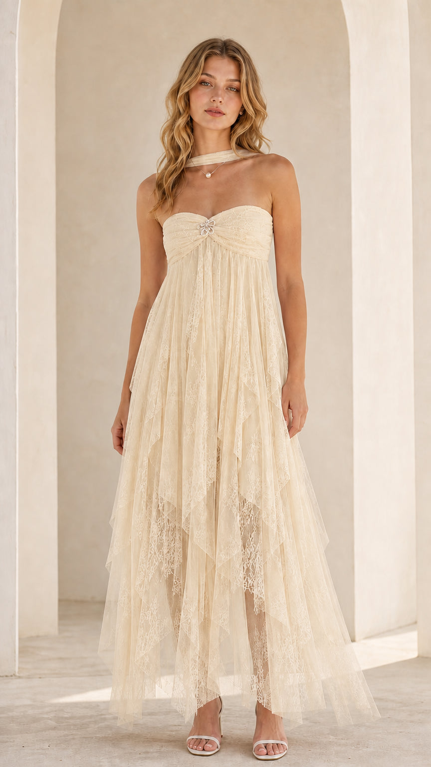 Model wearing cream strapless tulle maxi dress
