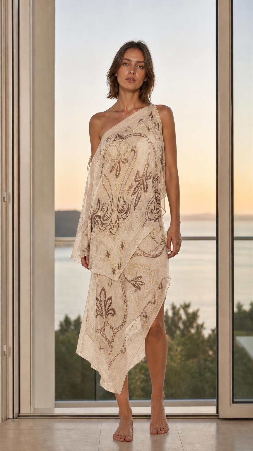 Model wearing ivory paisley one-shoulder maxi dress