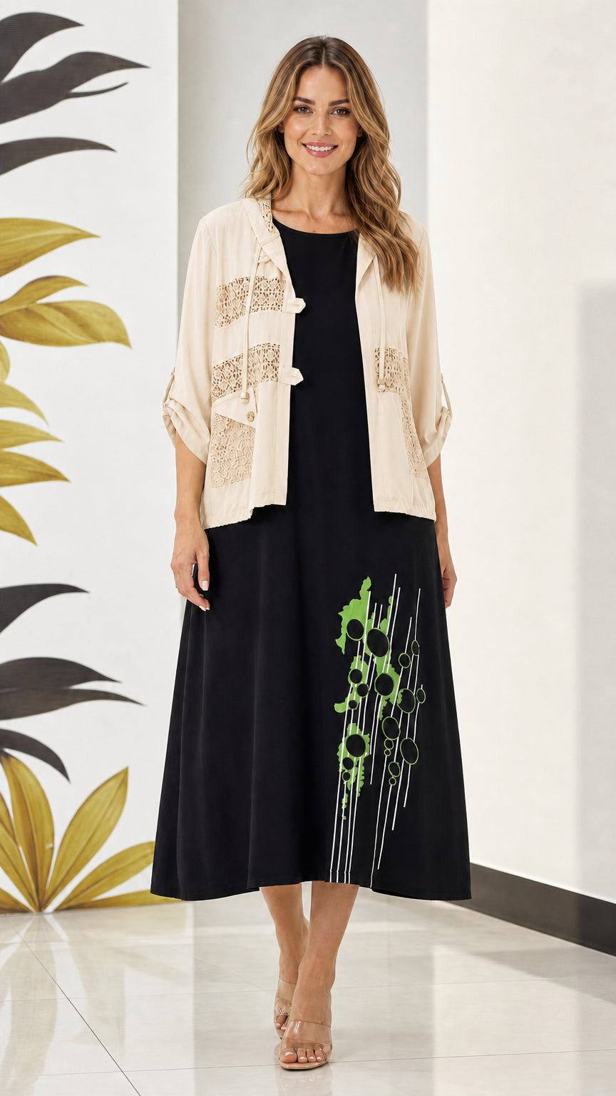 Model wearing beige cream lace hooded jacket with black printed midi dress set