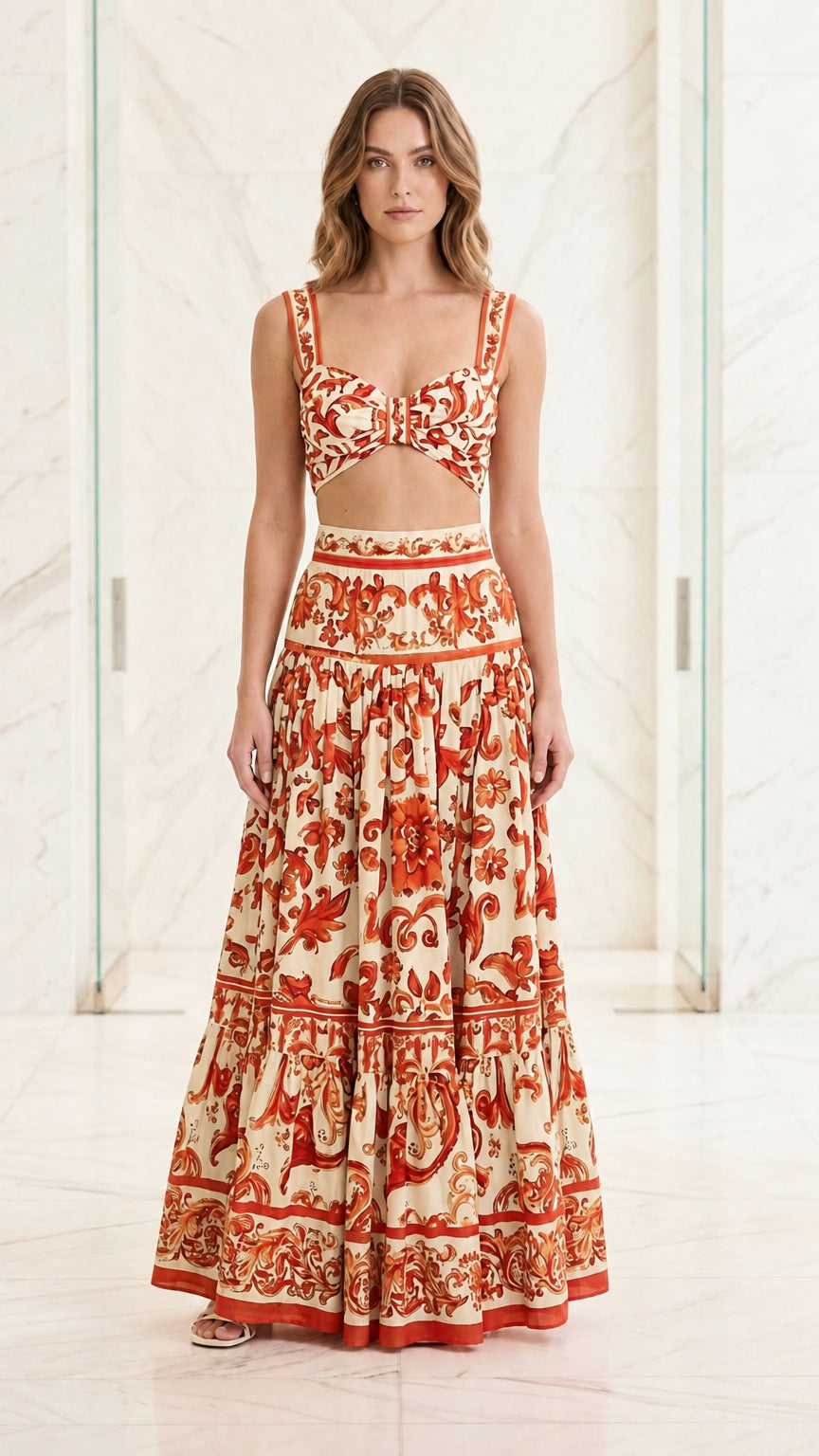 Woman wearing orange and cream baroque print two-piece set