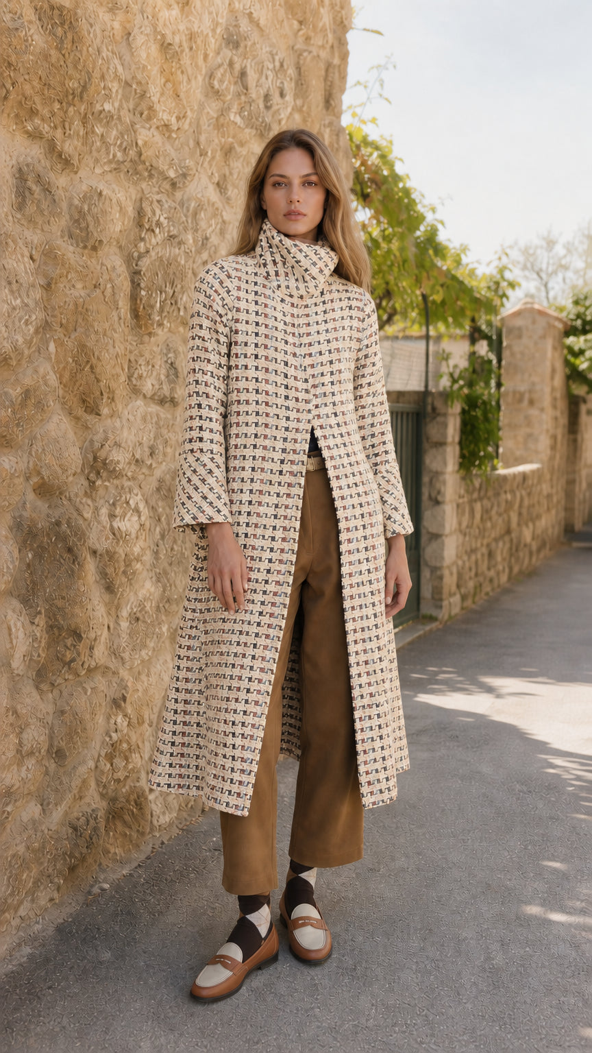 Model wearing cream off-white textured tweed stand collar long coat