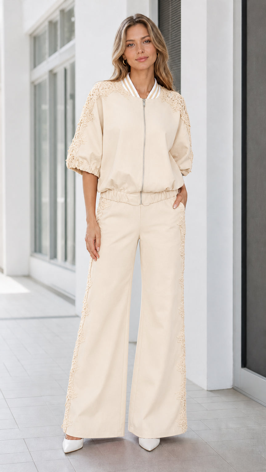 Front view of women's cream beige lace detail bomber jacket and wide-leg pant set