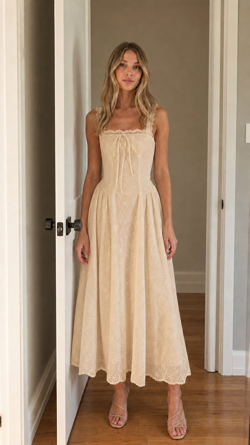 Front view of woman wearing beige square neck eyelet midi dress