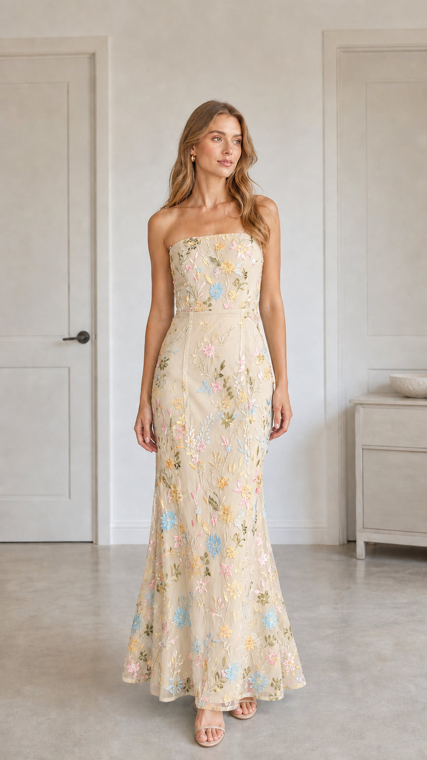 Front view of champagne floral embroidered strapless maxi dress
