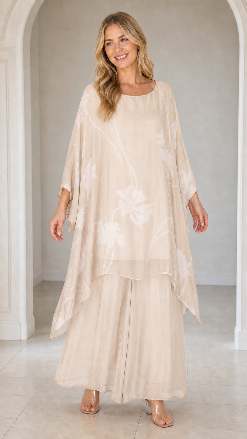 Front view of woman wearing beige floral kaftan set