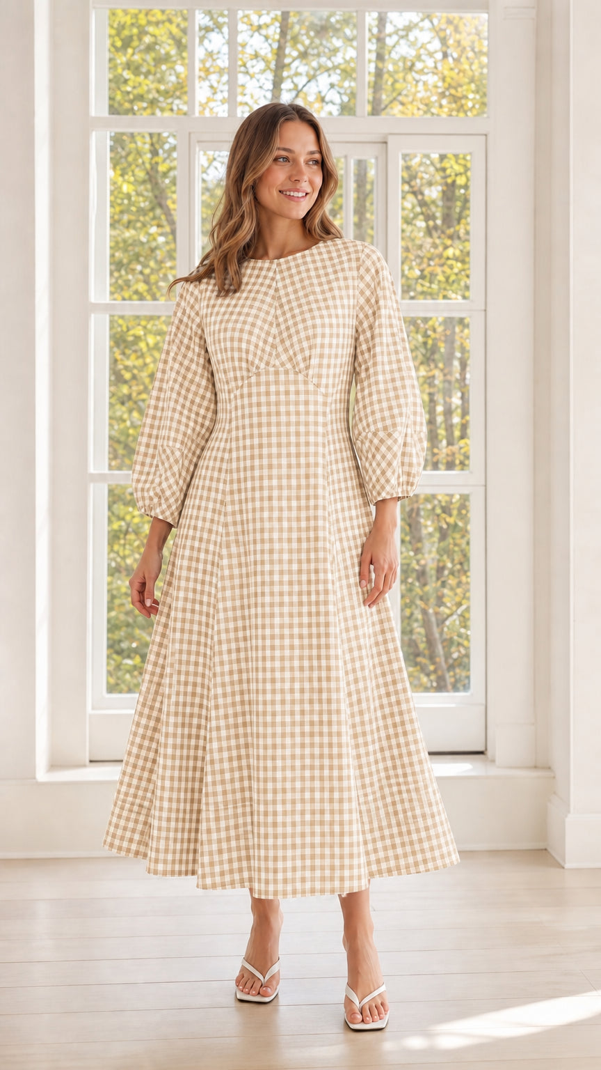Woman wearing beige gingham midi dress