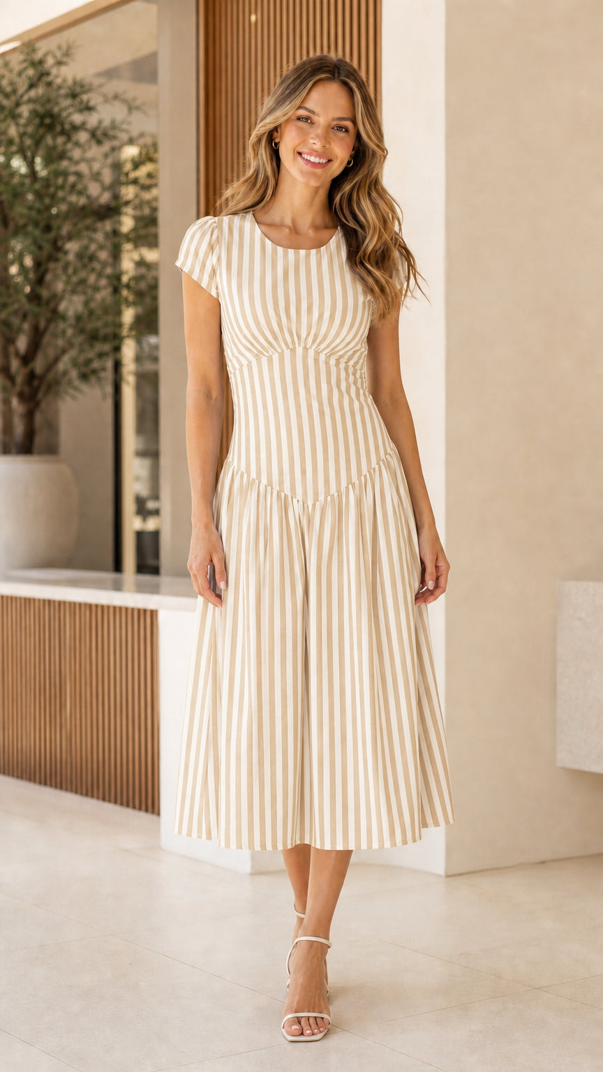 Woman wearing beige striped midi dress