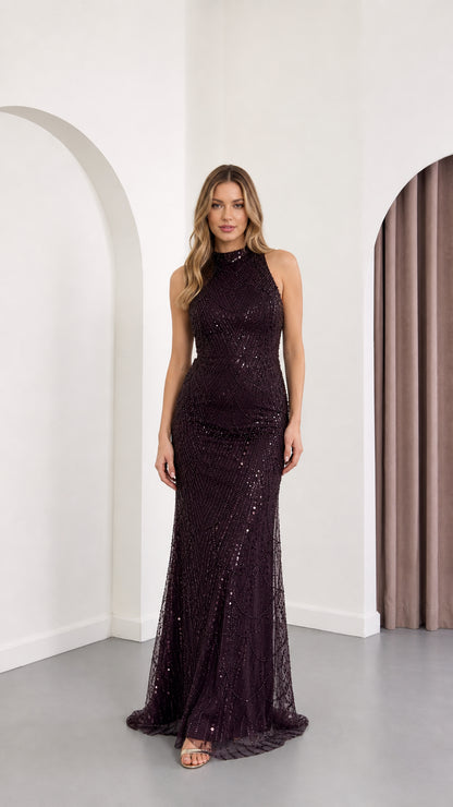 Front view of woman wearing sleeveless high neck sequin maxi evening gown in plum