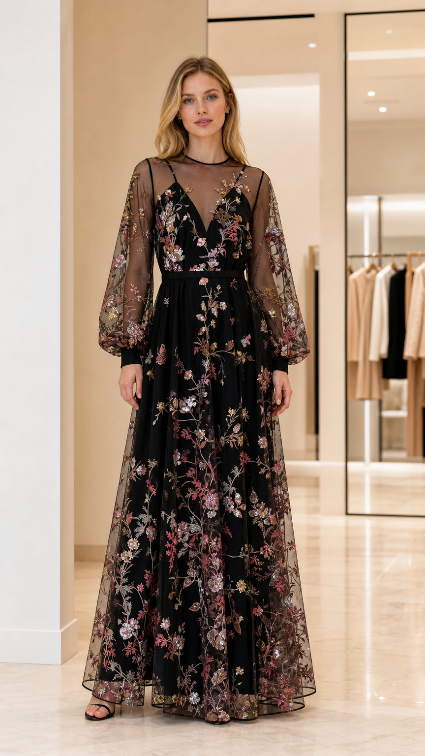 Front view of woman wearing black floral embroidered long sleeve maxi dress