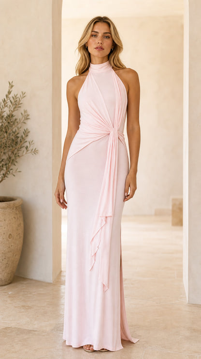 Front view of woman wearing Light Pink halter neck draped maxi dress