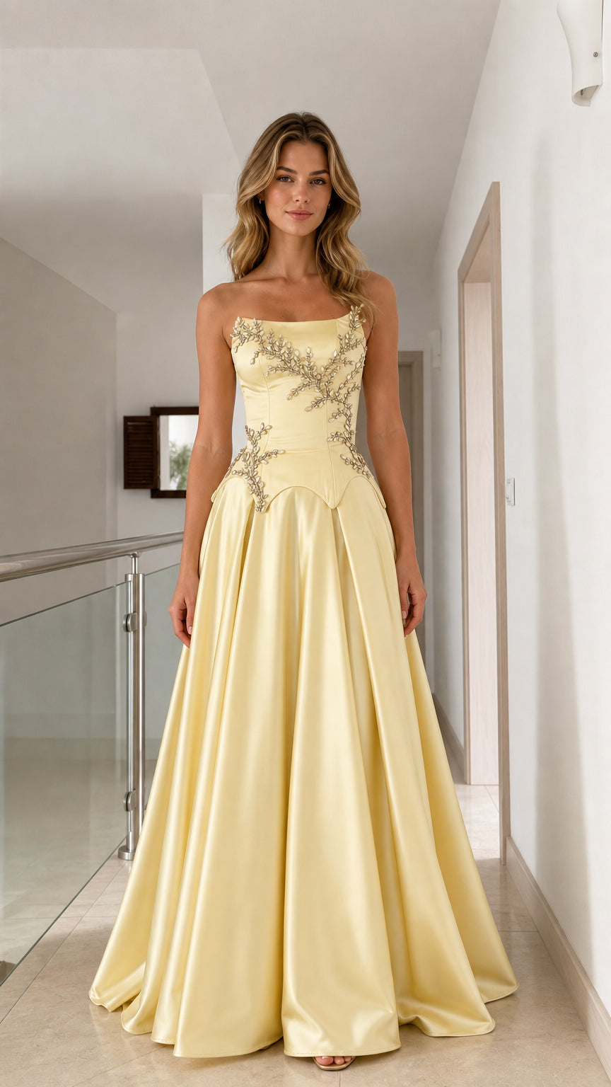 Model wearing pastel yellow strapless satin ball gown with crystal beaded basque waist - front view