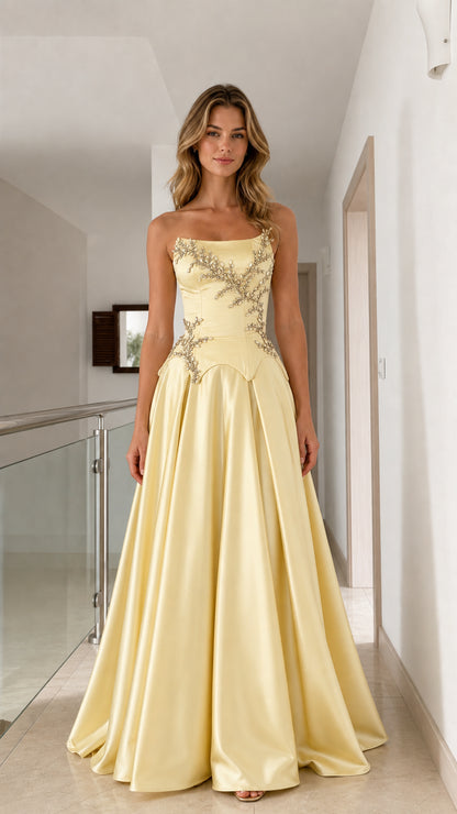 Model wearing pastel yellow strapless satin ball gown with crystal beaded basque waist - front view