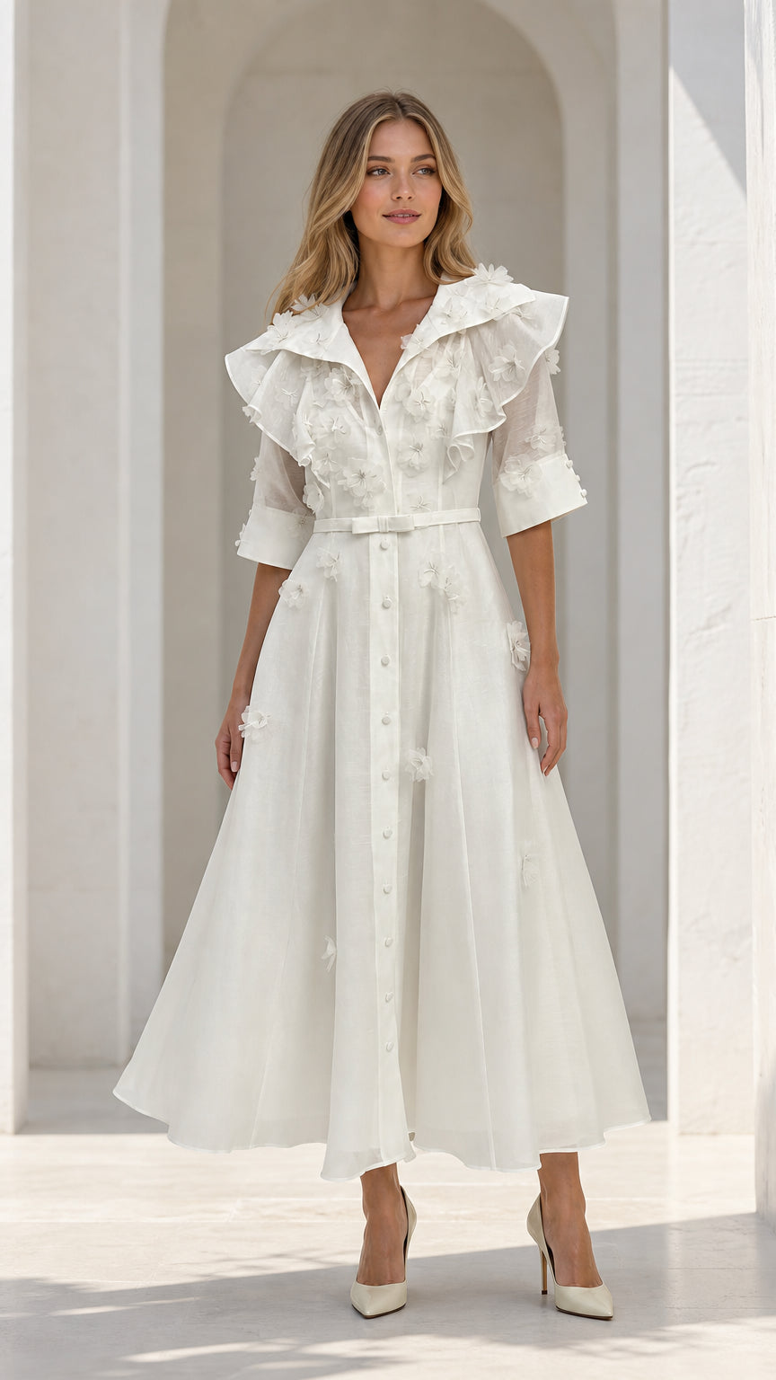 Front view of model wearing white floral applique ruffle midi dress