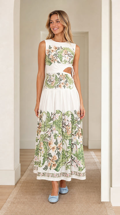 Front view of woman wearing white floral print cutout maxi dress