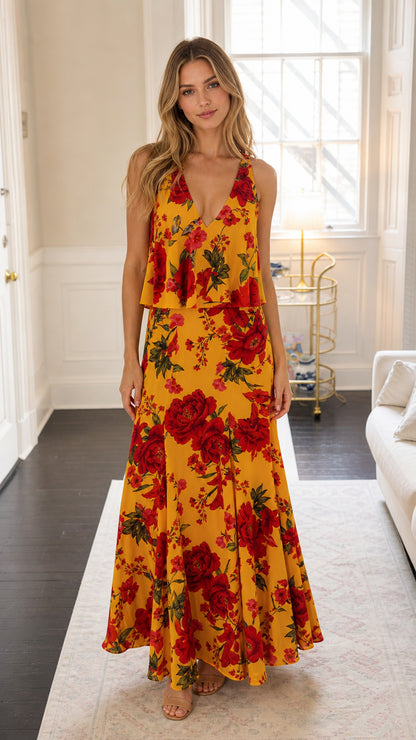 Front view of woman wearing yellow floral print layered maxi dress