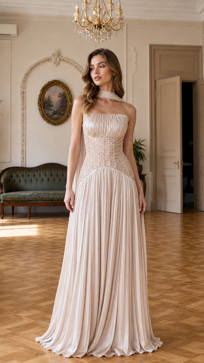 Front view of champagne pleated chiffon evening gown with beaded corset waist