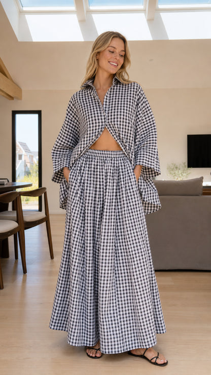 Woman wearing black and white gingham check shirt and wide-leg pants set front view