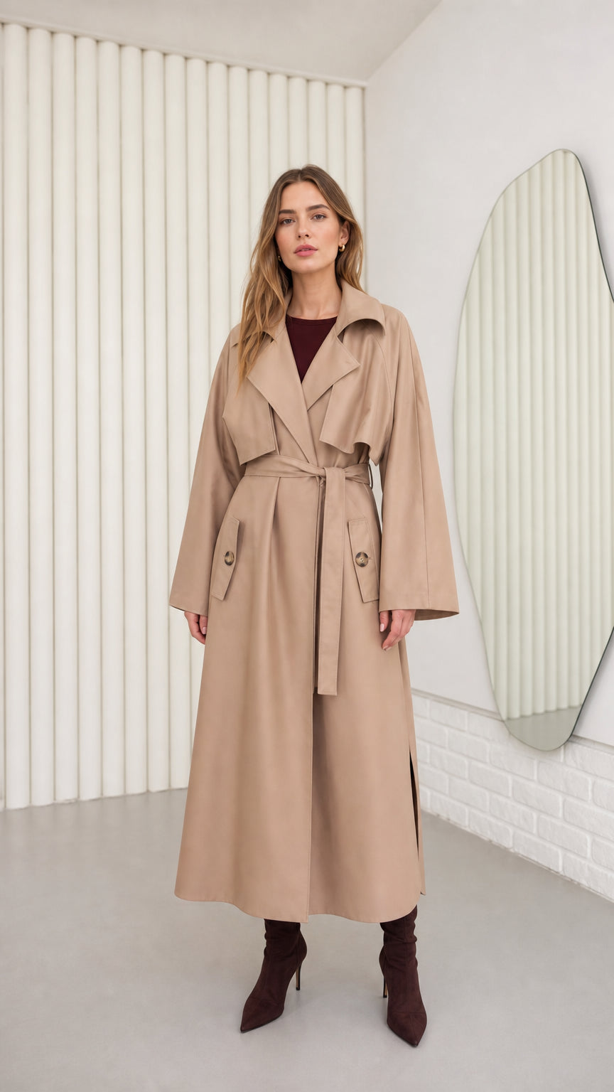 Full front view of model wearing a Camel maxi belted trench coat