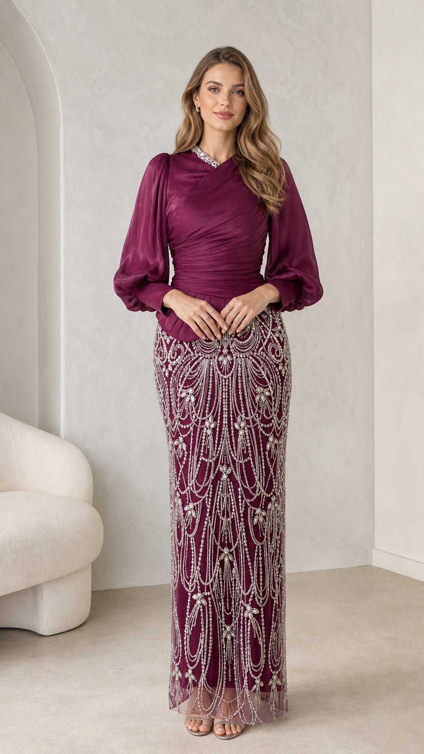 Front view of burgundy long sleeve embellished evening dress