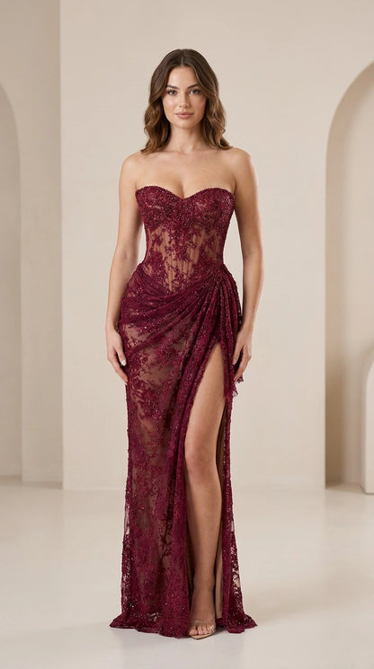 Front view of burgundy strapless lace evening dress with high slit