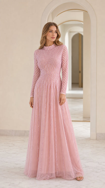 Front view of model wearing pink sequin long sleeve maxi dress