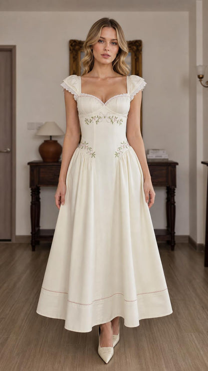 Front view of Ivory floral embroidered sweetheart midi dress