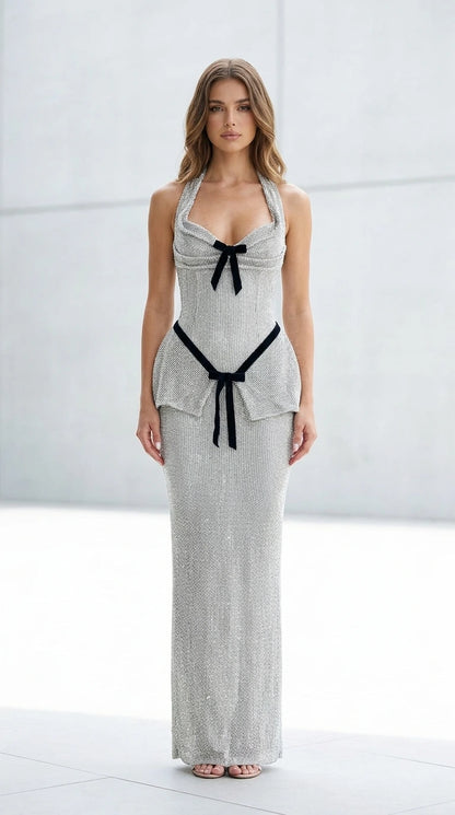 Front view of silver glitter halter maxi dress with velvet bows